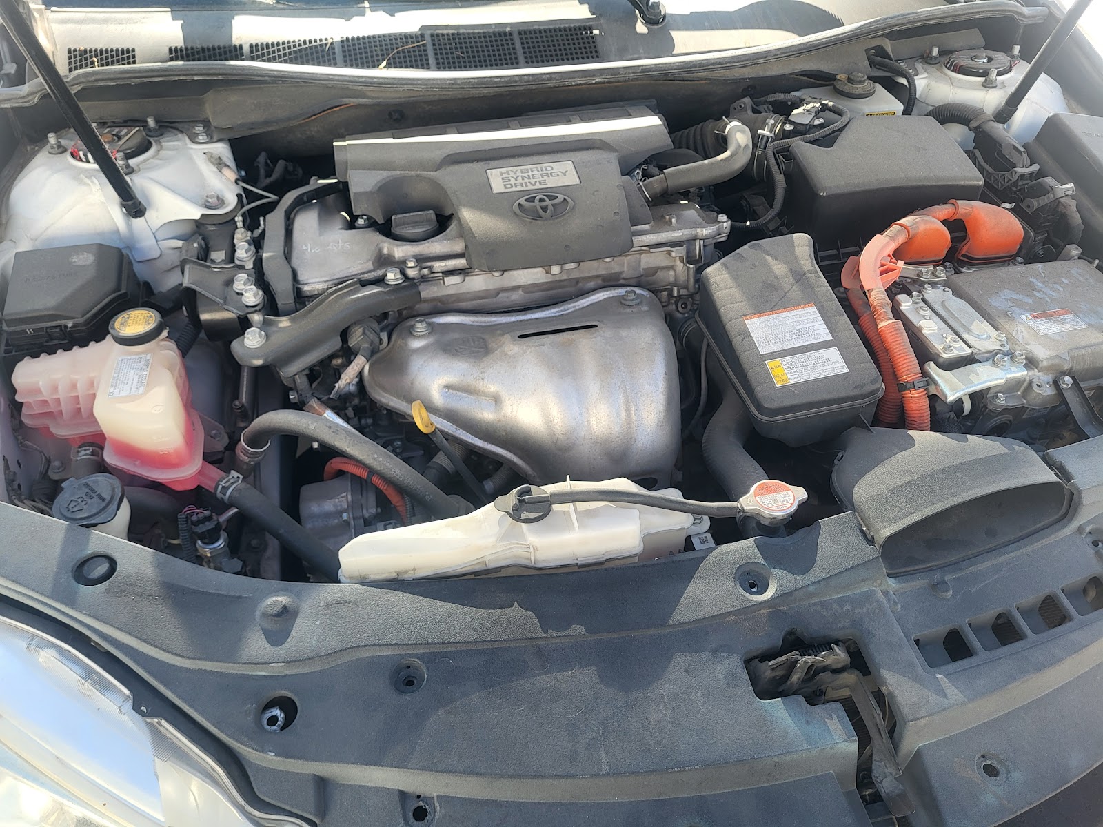 Engine bay of a Toyota Camry Hybrid Synergy Drive